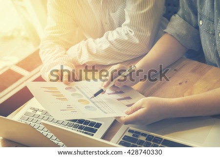 Teamwork process.Business people discussing the charts and graphs showing the results of their successful cooperation, Analyze financial report for business plan,selective focus,vintage color filter