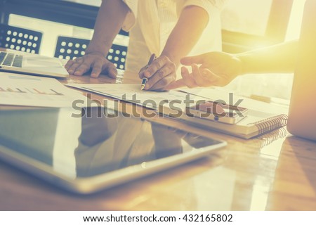 Team work concept,team meeting,man and woman working in the office. collaborative teamwork. Project managers meeting.business crew working with new startup. Analyze plans.selective focus,vintage color