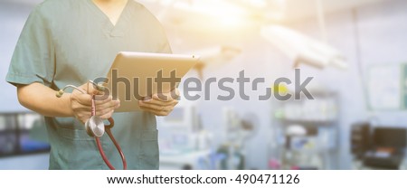 Male doctor,medical students or surgeon using digital tablet and laptop during the conference,Health Check with digital system support for patient,test results and patient registration,selective focus
