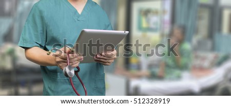 Male doctor,medical students or surgeon usingl tablet and laptop during the conference,Health Check with digital system support for patient,test results and data registration,selective focus