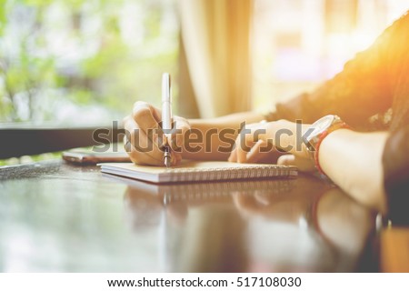 young girl writing into her diary about recipient address on mailing envelope,female hands sending letter,vintage color
