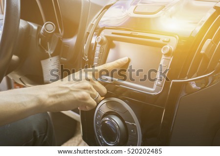 Transportation,technology and vehicle GPS,concept - man using car system control pushing panel button screen interface modern design
