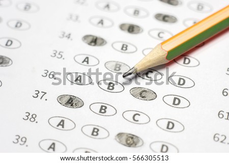 optical form of standardized test with answers bubbled and a black pencil examination,Answer sheet,education concept,selective focus,vintage color