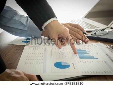 Businessmen are analyzing market data to clients or partners have been informed.