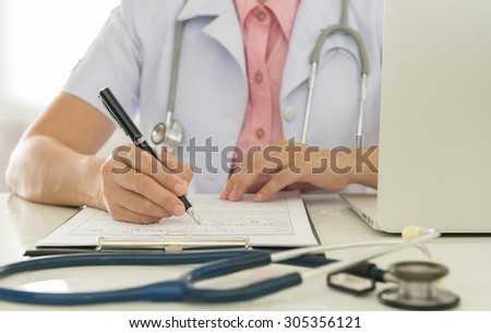 Doctors are working recorded patient data for analysis.