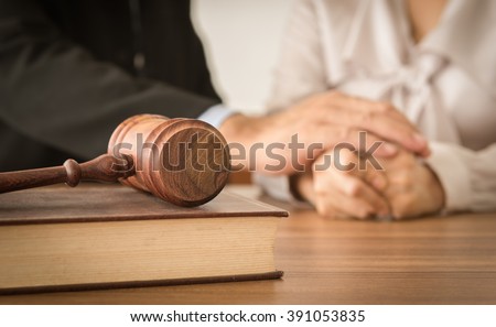 Gavel ,law books with attorneys provide legal advice and consoling to his clients in background. Divorce law ,Legal advice, Family law concept.