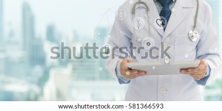 Doctor or medical students using digital tablet with medical icon at hospital. Medical technology network concept. copy space.