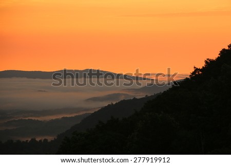 Foggy Mountain Morning.  Morning valley fog in the Blue Ridge Mountains as viewed from Bent Mountain, Virginia.