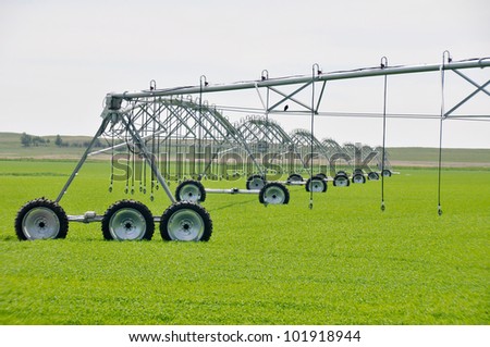 stock-photo-irrigation-sprinklers-in-a-farm-field-canada-101918944.jpg