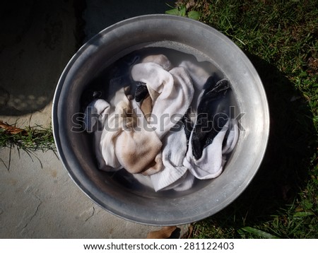 Cleaning dirty student socks use sun light help more sterilize and soaking with detergent about 1 day before wash.