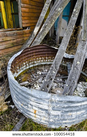 Corrugated iron water tank at ruined house