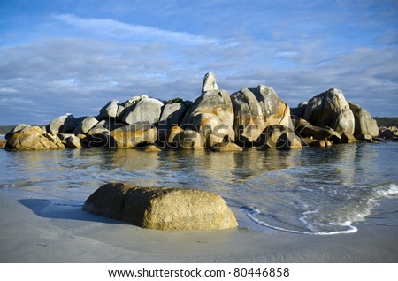Rocks and waves in beautiful morning light. Bay of Fires, Tasmania, Australia