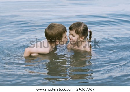 sister and brother kissing