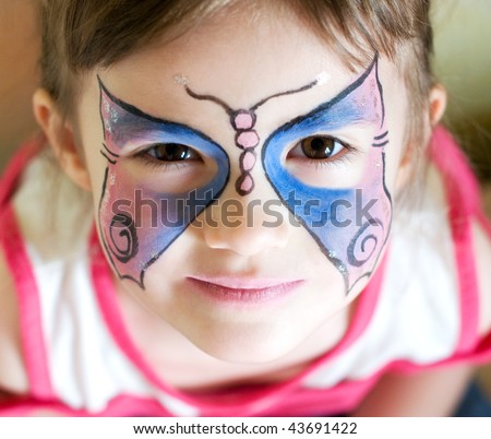 four years old girl with painted face