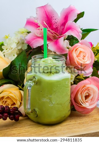 Green tea smoothies on wood table
