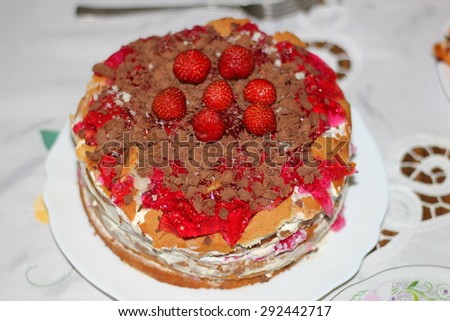 the homemade cake with jelly and strawberry decoration