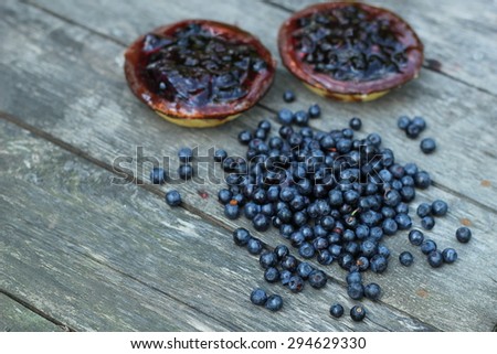 delicious juicy blueberries and cake laid on antique grey wooden floor