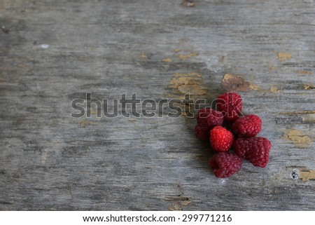 slide raspberries on a gray background