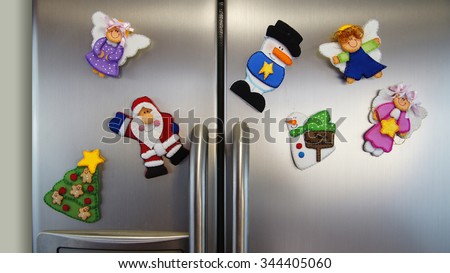 Angel magnet pin, Christmas tree magnet pin, snowman magnet pin, Santa Claus pin stuck in an aluminum double door refrigerator