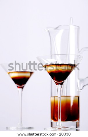 Bourbon mixed drink in martini glasses. Lot of white