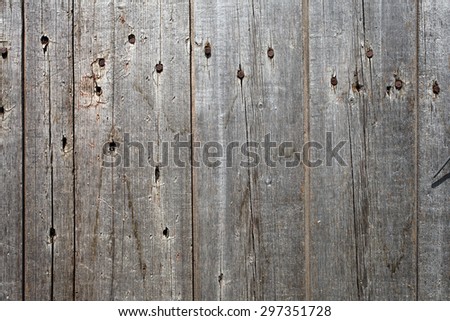 Old wooden board with nails, texture close-up background