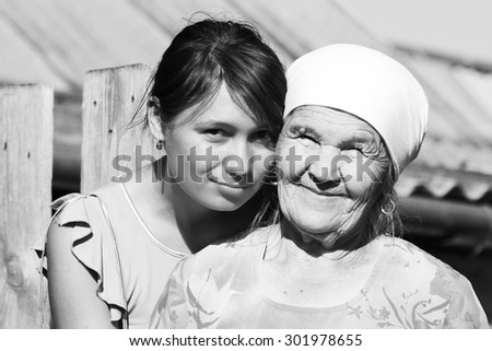 Black and white Grandmother in a scarf with her granddaughter