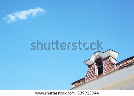 Traditional gable roof house under blue sky with cloud