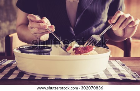 vintage business woman eating rice with Chinese sausage