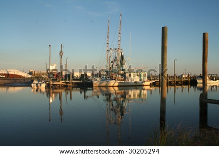 Gulf Coast Shrimp Boat at Harbor with Reflections on Calm Ocean Waters