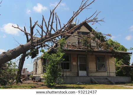 Trees in the direct impact of an EF-5 tornado are heavily damaged, causing further destruction to already fatally damaged man made structures.
