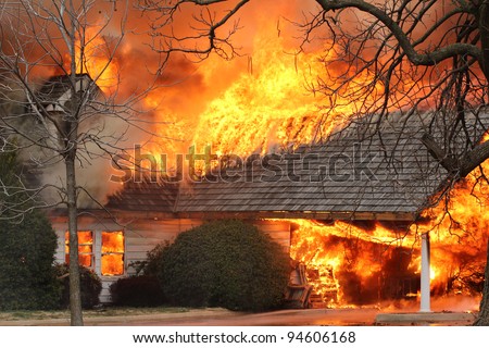 A house fire burns through the roof and spreads rapidly once it hits the open air, as oxygen acts as fuel for the fire.