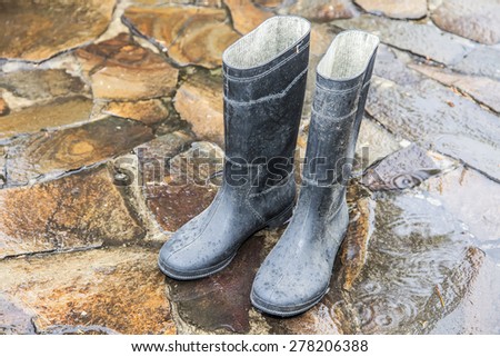 old rubber boots in the rain