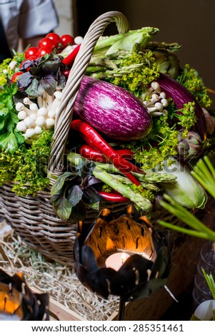 Wicker basket with lots of fresh vegetables and herbs from the village/Vegetable basket