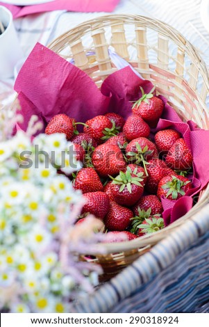 Ripe strawberries in a wicker basket/Ripe strawberries in a wicker basket