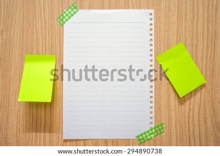 Blank white paper note and post it note paste on wooden cabinet