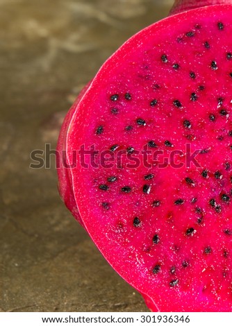 Sliced dragon fruit isolated on Cement background