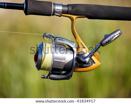 The fisherman with a fishing reel