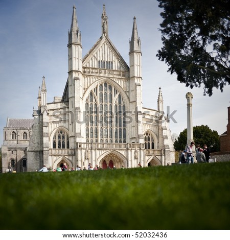 View of the Winchester Cathedral from grass on a beautiful day