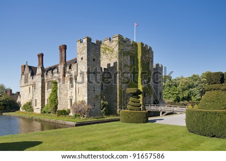 Magic medieval Hever Castle viewed over the water ditch on a sunny day