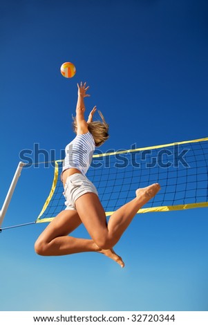 The young girl in high flying with a ball