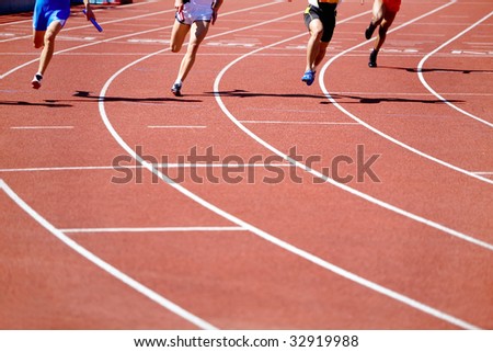 Kind of running legs of the men in relay race competition  in movement