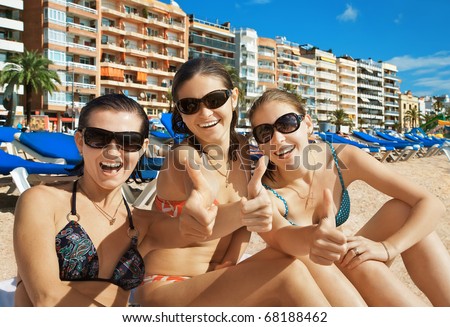stock photo Portrait of three ecstatic beautiful girls on beach resort