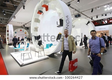 MILAN - APRIL 17: People look at home interior design solutions at Salone del Mobile, annual international furnishing accessories exhibition on April 17, 2012 in Milan, Italy.