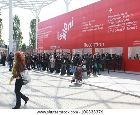MILAN - APRIL 17: People at the entrance of exhibition, ready to visit design pavilions at Salone del Mobile, international furnishing accessories exhibition on April 17, 2012 in Milan, Italy.