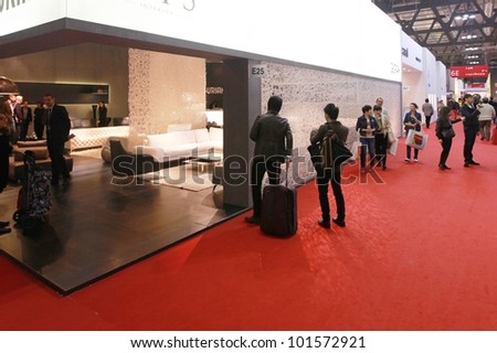 MILAN - APRIL 17: People visit interiors design pavilions at Salone del Mobile, international furnishing accessories exhibition on April 17, 2012 in Milan, Italy.