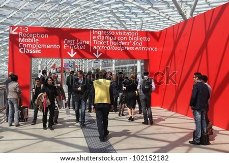 MILAN - APRIL 17: People entering Salone del Mobile, international furnishing accessories exhibition on April 17, 2012 in Milan, Italy.