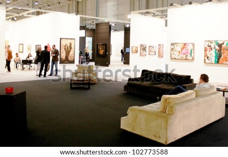 MILAN - MARCH 27: People trough the paintings galleries at MiArt ArtNow, international exhibition of modern and contemporary art March 27, 2010 in Milan, Italy.