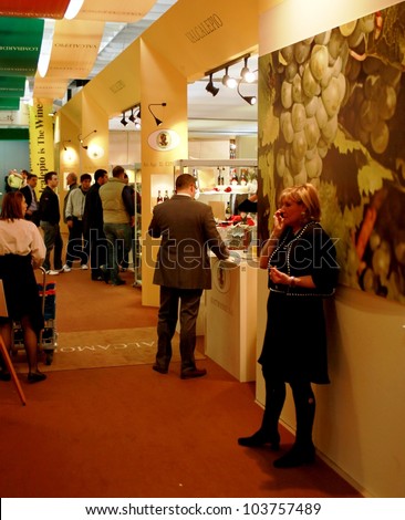 VERONA - APRIL 08: People visit wine tasting areas at regional and international pavilions during Vinitaly, international wine and spirits exhibition on April 08, 2010 in Verona, Italy.