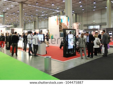 MILAN, ITALY - OCT. 19: People visiting technologies area during SMAU, international fair of business intelligence and information technology October 19, 2011 in Milan, Italy.