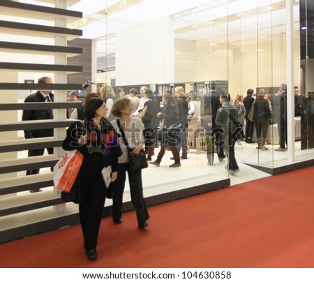 MILAN - APRIL 13: People visit interior design solutions area during Salone del Mobile, international furnishing accessories exhibition on April 13, 2011 in Milan, Italy.